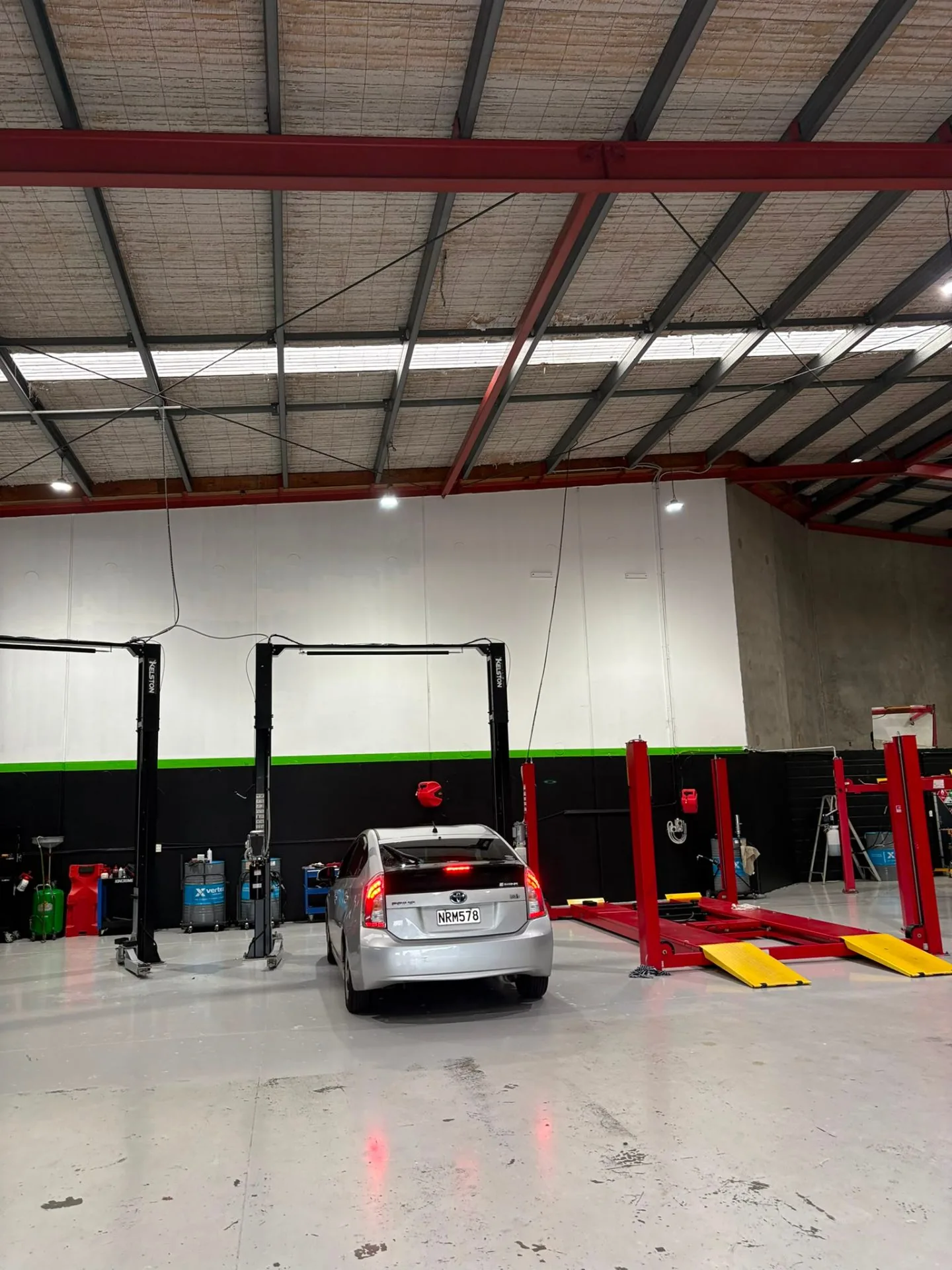Wide view of NexGen workshop with twin two-post hoists