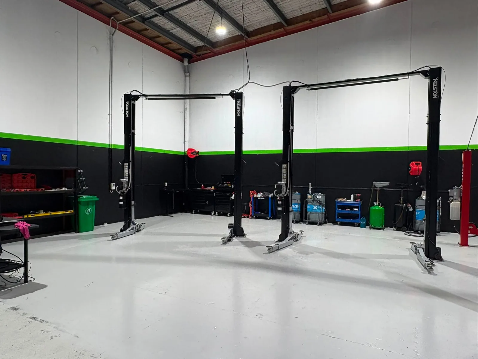 Service bay with hoists and NexGen green livery