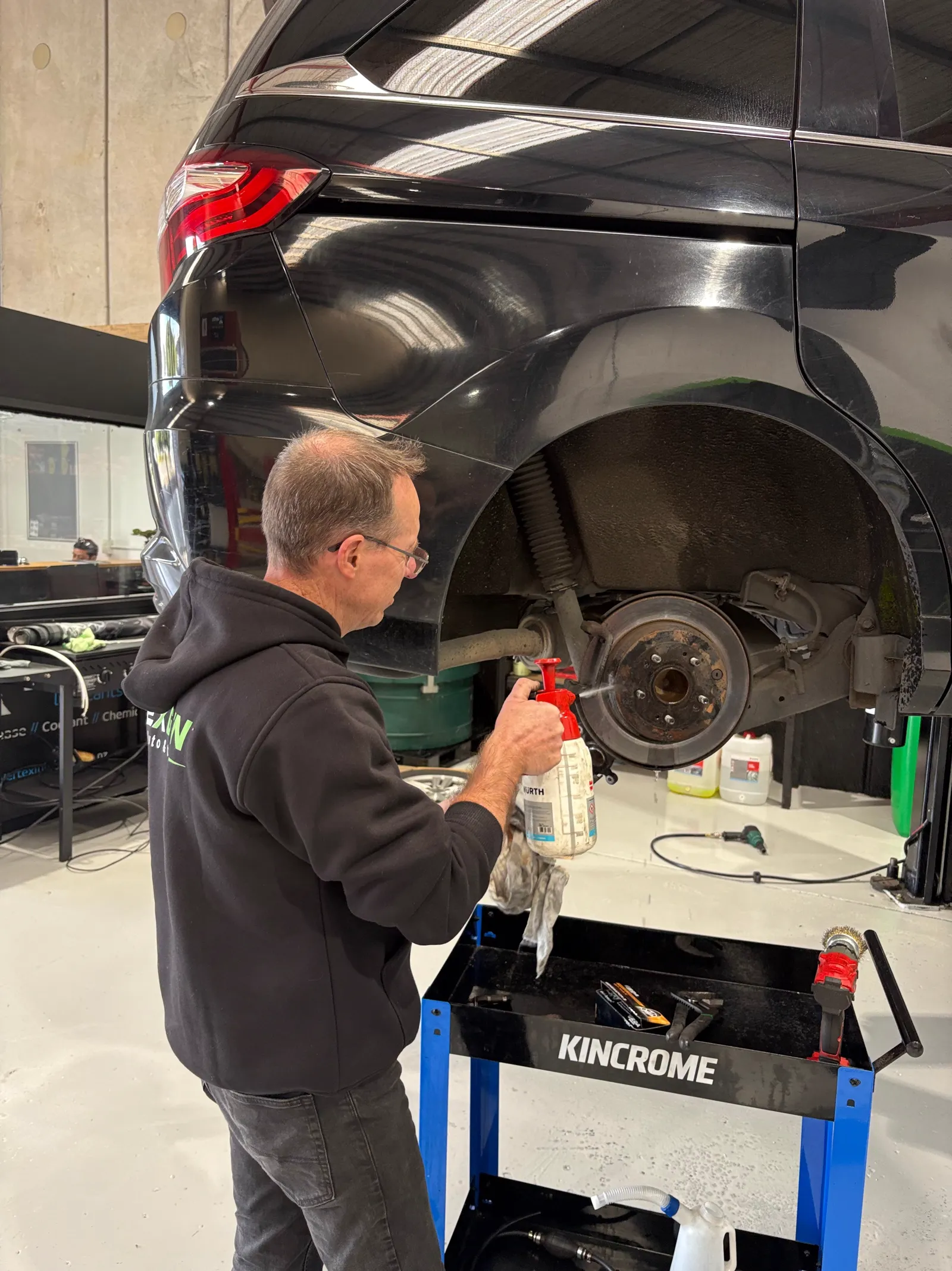 Cleaning the rear brake assembly during a service